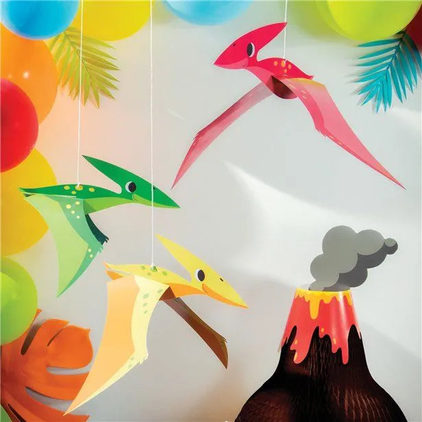 A dino birthday party set up, featuring the hanging Pterodactyl decorations, to give inspiration for your dino party. The set up includes colourful balloons and a paper volcano centrepiece. Balloons and paper volcano are not included in the product listing